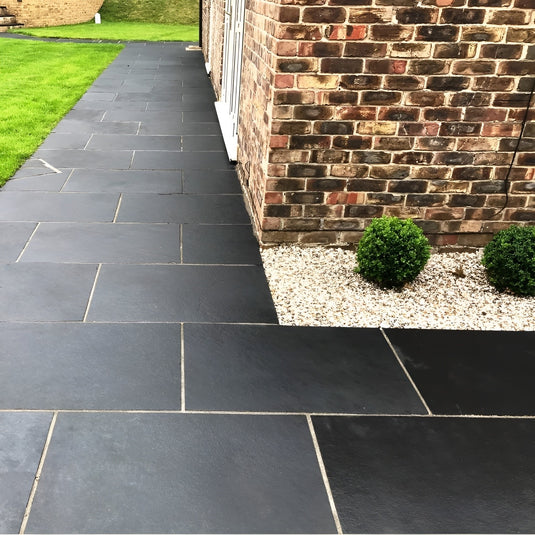 Kota Black Limestone Paving - 900 x 600 x 22mm - Sawn & Riven